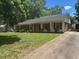 Charming single-story home featuring a well-maintained front yard and a long driveway at 708 Old Barn Ave, Durham, NC 27704