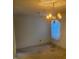 Spacious living room with a traditional chandelier and natural light at 708 Old Barn Ave, Durham, NC 27704