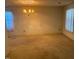 Spacious living room with a traditional chandelier and natural light at 708 Old Barn Ave, Durham, NC 27704