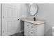 This bathroom shows a granite countertop and white vanity, plus modern black faucet and fixtures at 714 Harriett St, Henderson, NC 27536
