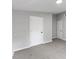A neutral-toned bedroom features plush carpeting and white doors and trim creating a comfortable atmosphere at 714 Harriett St, Henderson, NC 27536