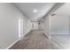 Bright hallway with new laminate flooring that extends into the living spaces at 714 Harriett St, Henderson, NC 27536