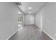 Well-lit hallway featuring modern gray walls and stylish laminate flooring leading to various rooms at 714 Harriett St, Henderson, NC 27536