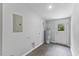 Spacious laundry room with gray walls, vinyl floors, and a convenient door to the outside at 714 Harriett St, Henderson, NC 27536