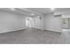 Bright, open living area featuring stylish gray vinyl flooring and neutral wall paint at 714 Harriett St, Henderson, NC 27536