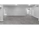 Spacious and bright living area with vinyl flooring and multiple entryways at 714 Harriett St, Henderson, NC 27536
