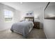 Serene bedroom featuring neutral colors, plush carpeting, and ample natural light from the window at 716 Blazer Bnd, Wendell, NC 27591
