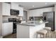 Modern kitchen features granite countertops, stainless steel appliances and a center island at 716 Blazer Bnd, Wendell, NC 27591