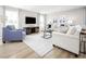 Bright living room showcasing hardwood floors, neutral decor, and lots of natural light at 716 Blazer Bnd, Wendell, NC 27591