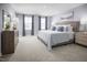 Serene main bedroom with soft carpet, neutral decor, and ample natural light at 716 Blazer Bnd, Wendell, NC 27591