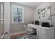 Bright home office with desk, chair, and large window overlooking lush greenery at 72 Merle Way, Wendell, NC 27591