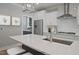 Modern kitchen with a center island, stainless steel appliances, and white cabinets at 72 Merle Way, Wendell, NC 27591