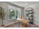 Home office featuring natural light, hardwood floors, and stylish desk and bookcase at 72 Merle Way, Wendell, NC 27591