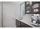Convenient wet bar featuring sleek cabinetry, a sink, and space for a coffee machine at 72 Merle Way, Wendell, NC 27591