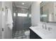 Modern bathroom with tiled shower, glass enclosure, and a sleek vanity at 7736 Roberts Rd, Apex, NC 27523