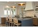 Gourmet kitchen featuring a large island, stainless steel appliances, and stone accents at 7736 Roberts Rd, Apex, NC 27523