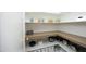 Walk-in pantry with custom shelving and countertop offering plenty of storage at 7736 Roberts Rd, Apex, NC 27523