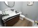 Contemporary powder room featuring a unique marble vanity and modern fixtures at 7736 Roberts Rd, Apex, NC 27523