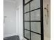 Modern shower featuring sleek glass enclosure, stone tiles, and contemporary fixtures at 7736 Roberts Rd, Apex, NC 27523