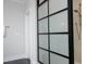 Contemporary shower with stone tiles, a modern glass enclosure, and elegant fixtures at 7736 Roberts Rd, Apex, NC 27523