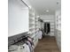 Well-organized walk-in closet with custom shelving, hanging rods, and ample storage space at 7736 Roberts Rd, Apex, NC 27523