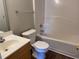 Cozy bathroom with a shower-tub combo, single sink vanity, and a sleek design at 78 Ariel Street, Lillington, NC 27546