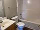 Cozy bathroom with a shower-tub combo, single sink vanity, and a sleek design at 78 Ariel Street, Lillington, NC 27546