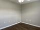 Bedroom with wood flooring, neutral walls, ceiling fan, and electrical outlets at 78 Ariel Street, Lillington, NC 27546