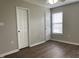 Bedroom features wood flooring, closet, ceiling fan, with neutral colored walls at 78 Ariel Street, Lillington, NC 27546