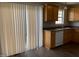 Modern kitchen with wood cabinets, and stainless steel appliances, and space saving blinds at 78 Ariel Street, Lillington, NC 27546
