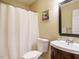 Bathroom features a toilet, vanity with sink, mirror, and shower with a curtain at 8204 Charlbert Ct, Apex, NC 27539