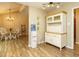 Open dining room with wood floors and built-in cabinet at 8204 Charlbert Ct, Apex, NC 27539