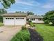 Lovely one-story home with a two-car garage and a well-maintained front yard with landscaping at 8204 Charlbert Ct, Apex, NC 27539
