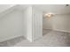 Finished attic space featuring neutral carpet and walls and a ceiling fan at 85 Pebble Creek Dr, Franklinton, NC 27525