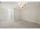 Finished attic space featuring neutral carpet and walls and a ceiling fan at 85 Pebble Creek Dr, Franklinton, NC 27525
