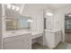 This elegant bathroom has dual sinks, a vanity area, and tile floors at 85 Pebble Creek Dr, Franklinton, NC 27525