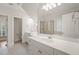 Bright bathroom featuring double vanity with modern fixtures, framed mirror and a glass enclosed shower at 85 Pebble Creek Dr, Franklinton, NC 27525