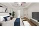 Inviting bedroom featuring a ceiling fan, a comfortable bed, and ample natural light at 85 Pebble Creek Dr, Franklinton, NC 27525