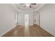 Bright bedroom with ceiling fan, tray ceiling, neutral paint, and large window offering an abundance of natural light at 85 Pebble Creek Dr, Franklinton, NC 27525