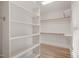 Walk-in closet features custom shelving and ample storage space at 85 Pebble Creek Dr, Franklinton, NC 27525