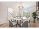 Elegant dining room featuring a round table, modern chairs, and natural light at 85 Pebble Creek Dr, Franklinton, NC 27525