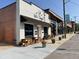 Charming tavern exterior featuring outdoor seating, awnings, and lovely flower planters at 85 Pebble Creek Dr, Franklinton, NC 27525