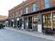 Downtown storefronts feature stylish exteriors with brick facades, awnings, and inviting entrances at 85 Pebble Creek Dr, Franklinton, NC 27525