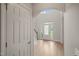 Spacious foyer featuring hardwood floors, an arched transom, and glass front door at 85 Pebble Creek Dr, Franklinton, NC 27525