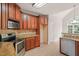 Spacious kitchen with stainless steel appliances, granite countertops, and custom cabinets at 85 Pebble Creek Dr, Franklinton, NC 27525