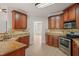 Stylish kitchen with custom wood cabinets, granite countertops, and stainless steel appliances at 85 Pebble Creek Dr, Franklinton, NC 27525