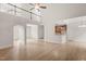 Open concept living space with tall ceilings, wood floors and archway to the kitchen area at 85 Pebble Creek Dr, Franklinton, NC 27525