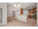 Open-concept living space boasts hardwood floors, and a combined kitchen with granite breakfast bar at 85 Pebble Creek Dr, Franklinton, NC 27525