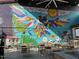 Outdoor patio with mural art and tables and chairs for dining at 85 Pebble Creek Dr, Franklinton, NC 27525