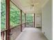 Relaxing screened-in porch with ceiling fan and wooded views at 85 Pebble Creek Dr, Franklinton, NC 27525